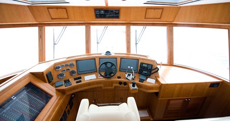 Boat helm station with navigation equipment for captain to use