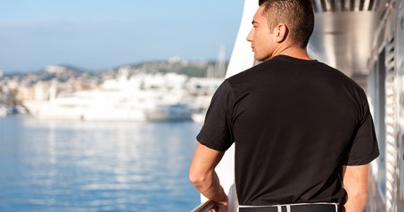 Hire Yacht Crew in uniform managing vessel.