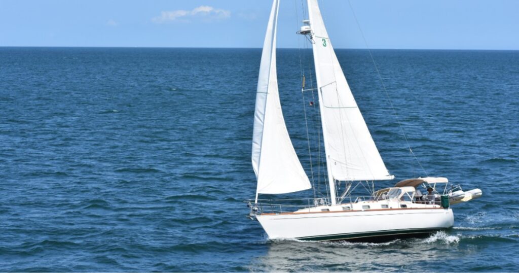 Sailboat sailing on open water.